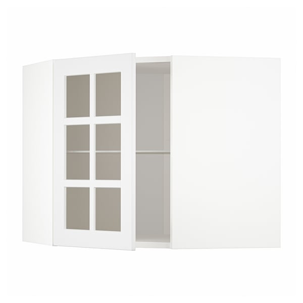 METOD white kitchen cabinet with glass door open, modern design.