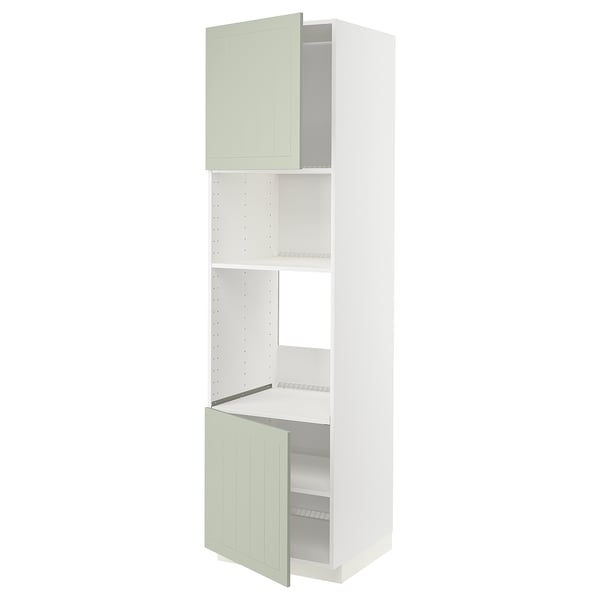 A tall, slim METOD kitchen cabinet in white with green stensund doors, featuring an adjustable shelf and a 25-year guarantee.