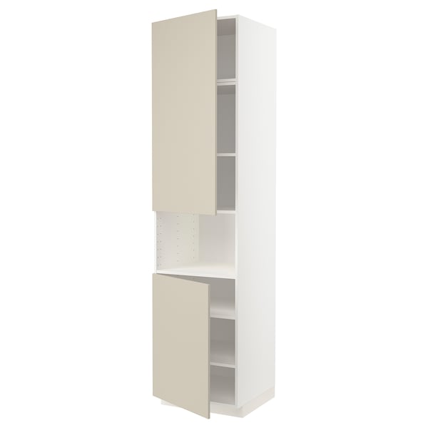 A METOD kitchen unit with beige havstorp doors, featuring two open compartments and an adjustable shelf inside, all in a clean, modern design.