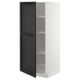A white METOD kitchen cabinet with a dark stained lerhyttan door, open, revealing adjustable shelves.