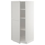 Open METOD kitchen cabinet with adjustable shelves and light grey fronts.