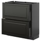 Black METOD kitchen unit with two large drawers and cabinet, sleek design.