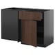 Modern kitchen unit: METOD with dark gray and brown wood drawers, sleek design.