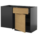 This image shows a modern, minimalist kitchen unit with a black frame and light wood-grain drawers, featuring integrated handles.
