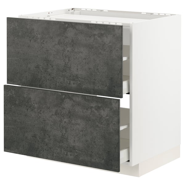 A METOD kitchen cabinet in white with dark grey drawers. Its rectangular with modern design and metallic hardware.