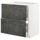 A METOD kitchen cabinet in white with dark grey drawers. Its rectangular with modern design and metallic hardware.