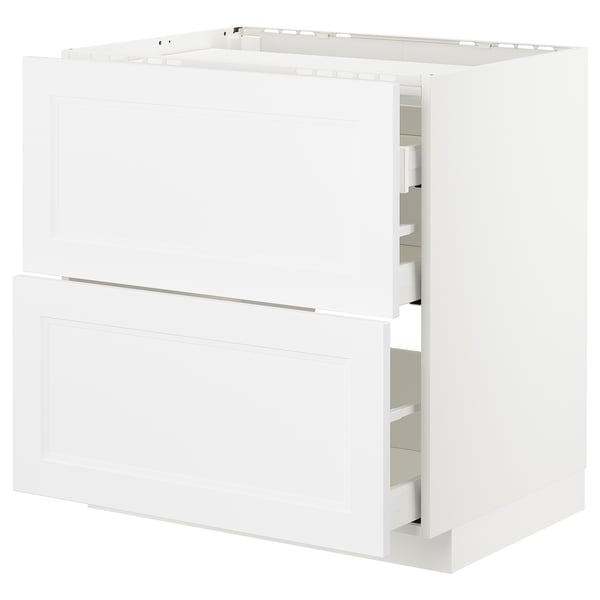 White METOD kitchen cabinet set, modern design, with multiple storage drawers and a built-in oven/sink space, white finish.