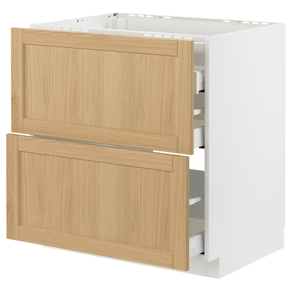 A METOD kitchen cabinet with forsbacka oak veneer drawers, white frame, and beveled edges.