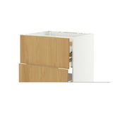 A white and light wooden kitchen cabinet with drawers and shelves.