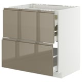 Modern kitchen cabinet with metallic gold doors and sleek handles.