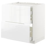 White high-gloss cabinet with integrated handles and drawers in METOD system.