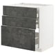 Modern dark grey concrete kitchen cabinet with three large drawers.
