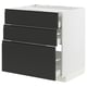 A modern black and white kitchen cabinet with three drawers. The cabinet has a sleek, minimalist design with integrated handles.