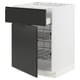 A white METOD kitchen cabinet with matte black drawers and integrated handles, featuring multiple wire shelves inside.