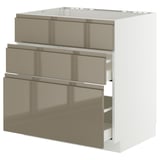 A modern, white METOD kitchen cabinet with three high-gloss, dark grey-brown drawers and sleek handles.