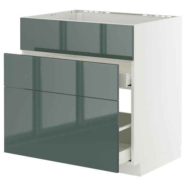 Modern kitchen unit, grey-green high-gloss drawer fronts, self-closing drawers, white frame.