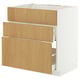 A white METOD kitchen cabinet with three light wood drawers. The cabinet is rectangular and has a sleek, modern design.