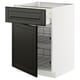 Modern kitchen unit, white and black. Open drawer and shelf space. Clean, organized design.