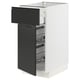 Modern white kitchen cabinet with matte black drawer, metal shelves, integrated handle, and sleek design.