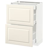 A white METOD kitchen cabinet with off-white bodbyn fronts and beveled edges. It two drawers with smooth runners.