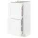 White METOD kitchen cabinet with two doors and internal shelves. Modern, rectangular design with subtle wood grain texture.
