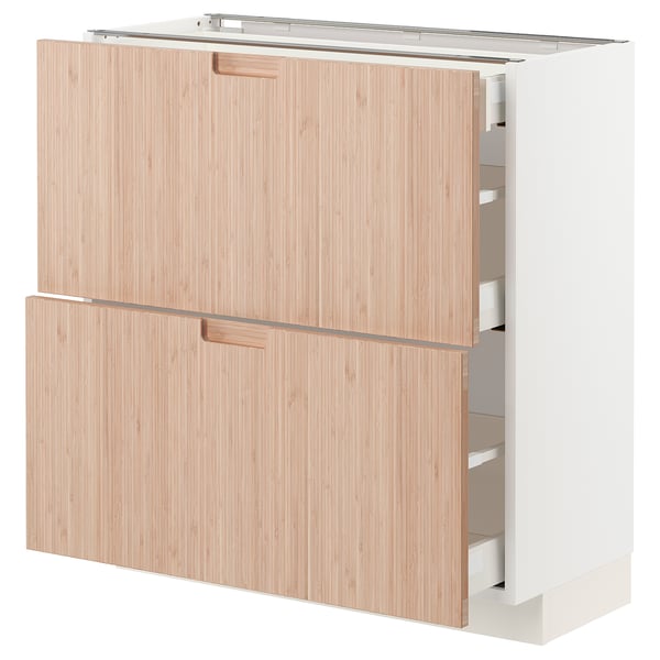 Modern, white METOD kitchen cabinet with natural bamboo doors, featuring sleek, minimalist handles.