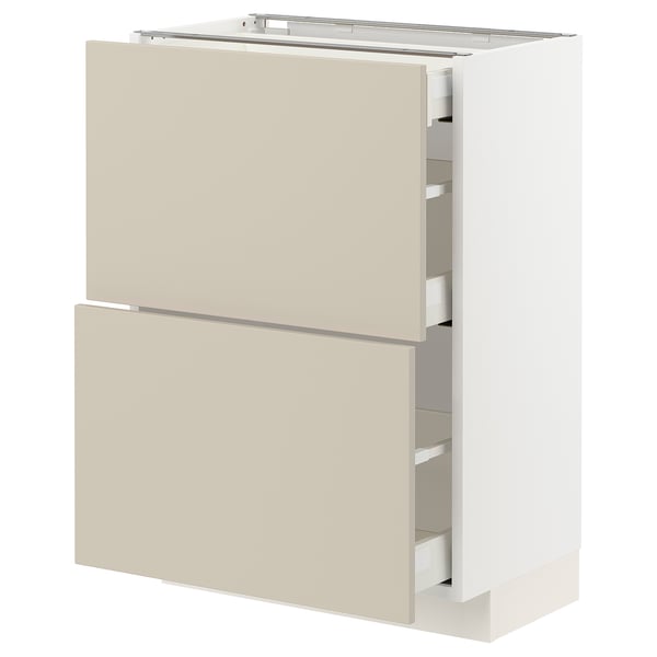 A beige METOD kitchen cabinet with multiple drawers.
