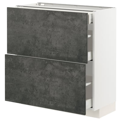 A modern kitchen cabinet named METOD with dark grey, concrete effect kalhyttan fronts. It multiple drawers with a sleek, urban design.