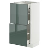 Modern kitchen cabinet in white and high-gloss grey-green with pull-out drawers.