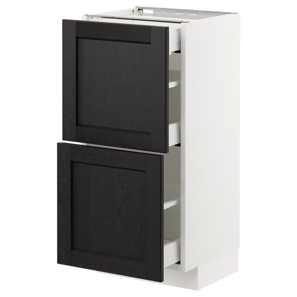 A tall white and black kitchen cabinet from the METOD system with two black stained wooden doors and integrated shelves.