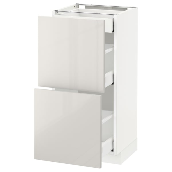 White METOD kitchen cabinet, glossy, with two drawers, sleek design.