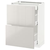 White METOD kitchen unit with drawers, glossy finish, sleek design.