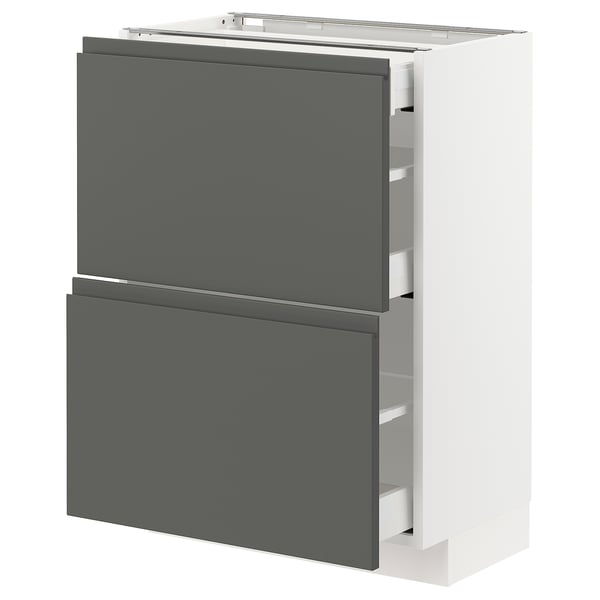 Modern white and dark grey kitchen cabinet with drawers. Integrated handles, sleek design, and smooth drawer runners.