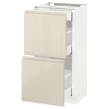 A white IKEA METOD kitchen unit with two high-gloss beige drawers.