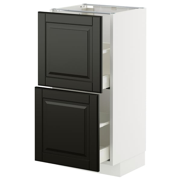 A white METOD kitchen cabinet with black bodbyn fronts, featuring two drawers and a cabinet door.