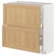 Modern kitchen cabinet with oak wood doors. Drawers, white framed.