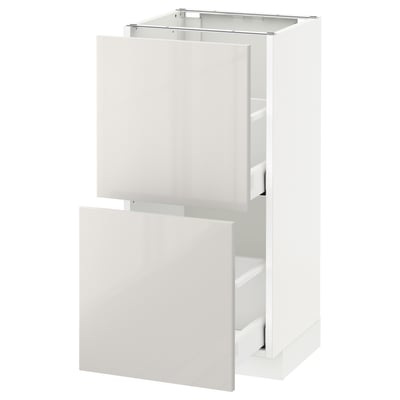 Modern white kitchen cabinet with glossy finish and clean lines. Two doors and empty interior, part of the ikea METOD system.