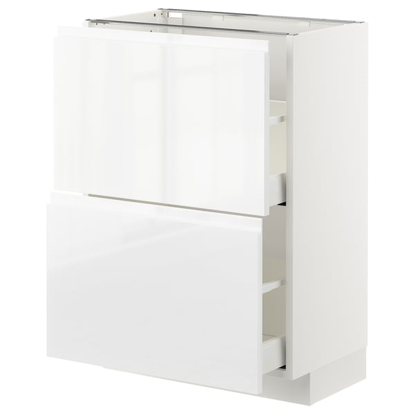 A white ikea METOD kitchen cabinet with glossy finish, featuring two large drawers and a shelf at the top.