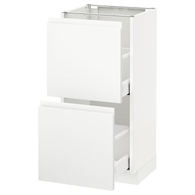 A white ikea METOD kitchen cabinet set with integrated handles and a sleek, modern design.