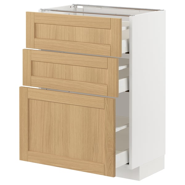 The METOD kitchen unit with light wood drawers and a white frame. It has three pull-out drawers with smooth-running mechanisms.