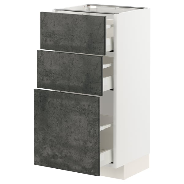 A white METOD kitchen cabinet with three dark grey kalhyttan drawers. It a sleek, modern design with a concrete effect finish.