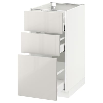 White ikea METOD kitchen cabinet with glossy drawers.
