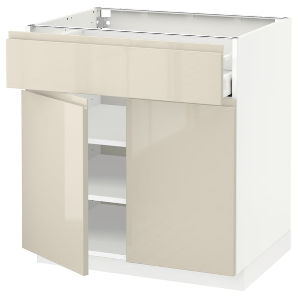 Modern kitchen cabinet: METOD, beige, glossy, three doors, two shelves, sleek design, sturdy build.