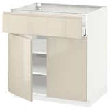 Modern kitchen cabinet: METOD, beige, glossy, three doors, two shelves, sleek design, sturdy build.