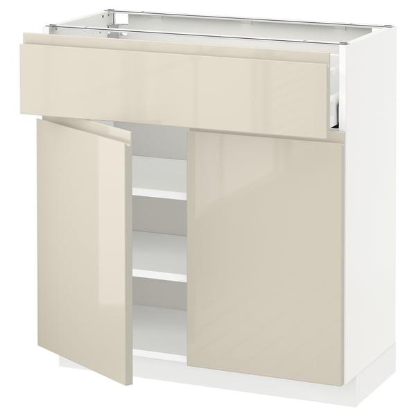 White-beige METOD kitchen cabinet with glossy finish, two removable doors, adjustable shelves, integrated handles, and soft-close hinges.