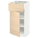 A white and light wooden METOD kitchen cabinet with an open drawer and door, revealing shelves inside.