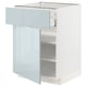 Displays a white METOD kitchen cabinet with a light blue-gray glossy drawer and door, featuring an open drawer showcasing inner shelves.