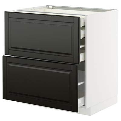 Black and white kitchen cabinet with drawers, sleek design, modern look. Part of the METOD system, durable materials.