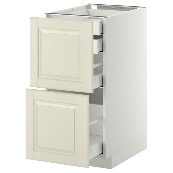 A white ikea METOD kitchen cabinet with beveled off-white bodbyn drawer fronts, featuring self-closing drawers.