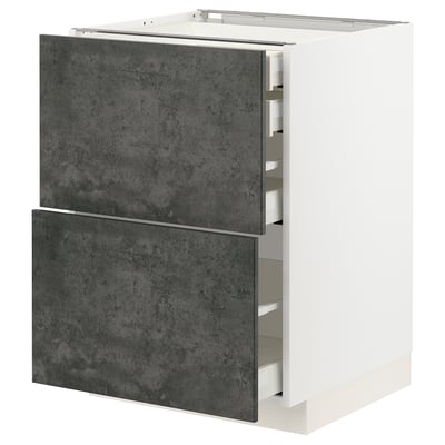 This image shows a white METOD kitchen cabinet with dark grey concrete effect drawers, featuring a modern urban design.